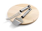 Wooden cheese board with a metal cheese knife and a slicer.