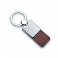 Key holder with shiny metal finish and PU leather strap.