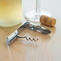 Bottle opener and corkscrew with shiny crome finish in high tech