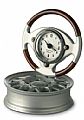 Analogue clock in wooden steering wheel with wheel rim metal sta