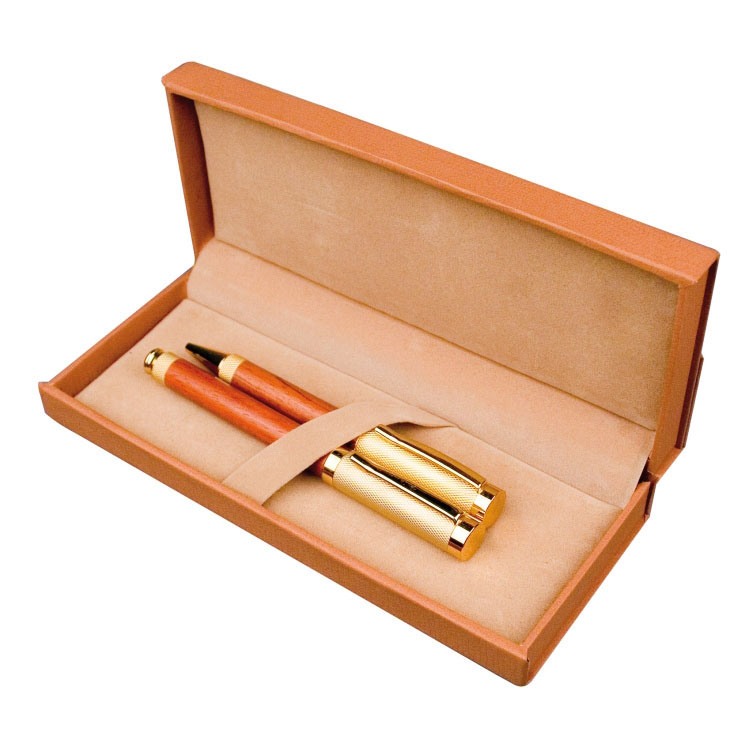 Stylish wooden pen set with a brass finish, consisting of a ball