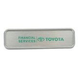 Silver metal badge with magnet and branding